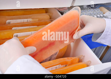 https://l450v.alamy.com/450v/g04720/biotechnology-frozen-plasma-bag-blood-plasma-freezer-laboratory-company-g04720.jpg