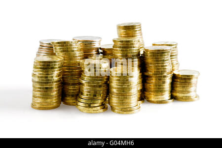 pile of brilliant metallic coins on a white backgr Stock Photo