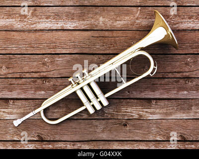 Trumpet on wood Stock Photo