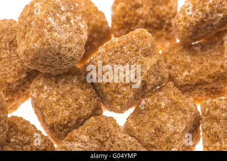 Rough unrefined brown sugar cubes Stock Photo