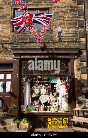 UK, England, Yorkshire, Haworth 40s Weekend, bunting flying above Rose & Co’s household goods shop Stock Photo