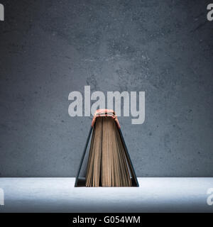 Old vintage book on stone table. Still life with copyspace. Concept of literature, education and history. Stock Photo