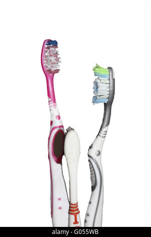 Grey and pink tooth brushes on the blue marble bac Stock Photo