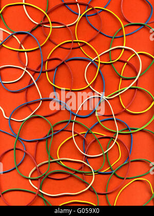 Background from many multi-colored writing elastic bands Stock Photo