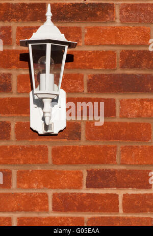 white classic lamp on a brick wall (copy-space available) Stock Photo
