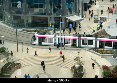 The Birmingham Metro Tram traveling along Bull Street through the City Centre after shortly leaving Snow Hill Station. Stock Photo