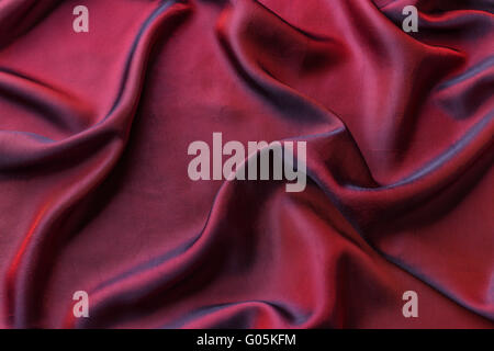 Red satin fabric as background Stock Photo