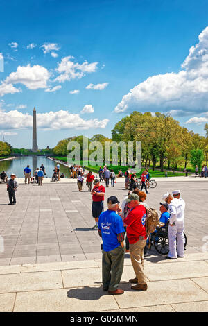 Washington DC, USA - May 2, 2015: War Veterans and guardians of Honor Flight of Middle Tenessee non-profit organization near Lincoln Memorial Reflecting Pool. Washington Monument on background Stock Photo