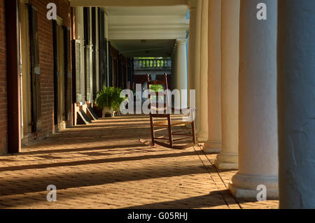 Rocking chair outside the Lawn rooms at The Rotunda, University of Virginia. Charlottesville, VA, USA Stock Photo