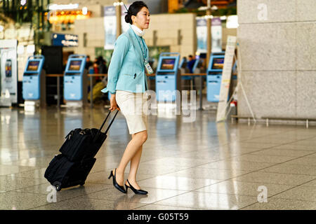 Incheon, South Korea - February 15, 2016: Asian Korean female air flight attendant in Incheon International airport Stock Photo