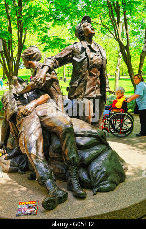 Washington DC, USA - May 2, 2015: Tourists and War Veterans and guardians of Honor Flight nonprofit organization in Vietnam Women Memorial in the National Mall. Devoted to nurses in the Vietnam War. Stock Photo