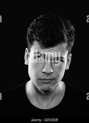 confused young man studio portrait Stock Photo