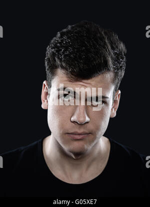 confused young man studio portrait Stock Photo