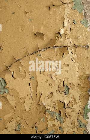 Old crumbling paint layers wall as background Stock Photo