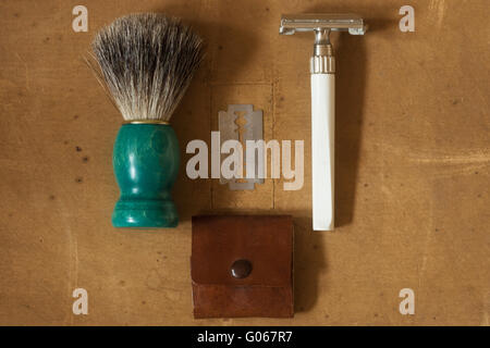 Flat Lay of Shaving Equipment on wooden Table and vintage Backdrop Stock Photo