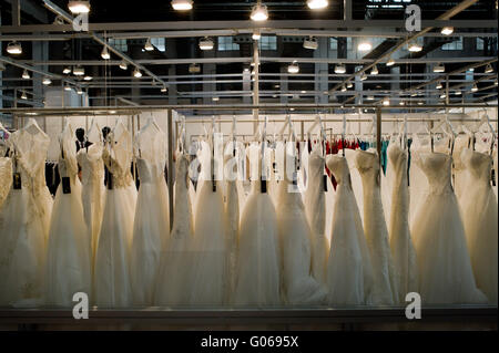 Wedding dresses are exposed in a stand during the Barcelona Bridal Week Professional Trade Fair. Stock Photo