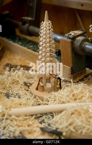 Seiffen, Germany. 11th Apr, 2016. A traditional handcrafted wooden nativity scene with a chipped wood tree is on display in the visitors' workshop of 'Erzgebirgische Volkskunst Richard Glaesser Seiffen GmbH', manufacturer of traditionally hand-made wooden souveniers, toys and wooden craftwork in Seiffen, Germany, 11 April 2016. The company offers visitors an insight into selected caftsmen techniques, traditional local products and allows visitors to experience 'Christmas' all year round. Photo: Arno Burgi/dpa/Alamy Live News Stock Photo