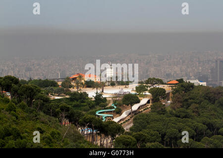 London UK. 30th April 2016. A horse riding school overlooking Beirut skyline choking under  a thick layer of Nitrogen Dioxide  pollutants caused by  the influx of refugees from neighbouring Syria which  has drastically altered the air pollution levels Credit:  amer ghazzal/Alamy Live News Stock Photo