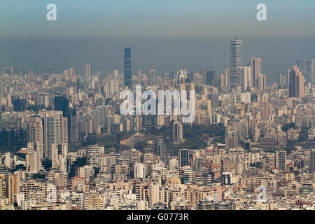 London UK. 30th April 2016. A horse riding school overlooking Beirut skyline choking under  a thick layer of Nitrogen Dioxide  pollutants caused by  the influx of refugees from neighbouring Syria which  has drastically altered the air pollution levels Credit:  amer ghazzal/Alamy Live News Stock Photo