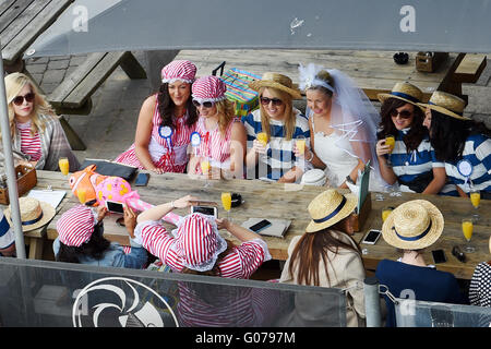 Brighton UK 30th April 2016  - A bride and her hen party enjoy the Spring Bank Holiday weekend sunshine on Brighton seafront as crowds flocked to the coast despite the cool temperatures  Credit:  Simon Dack/Alamy Live News Stock Photo