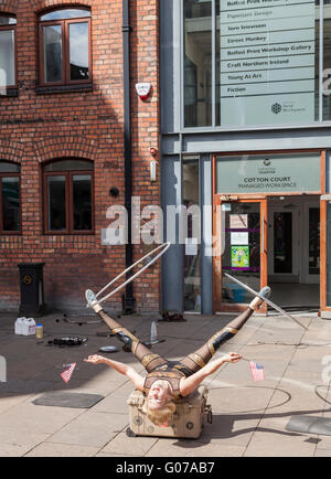 Belfast, UK, 30th April 2016. Festival of Fools. Street performers from across the world entertain in venues around the city. Kamikaze Fireflies entertain in Cotton Court. Credit:  J Orr/Alamy Live News Stock Photo
