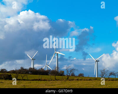 Wind turbines in farmland near Bothel in Cumbria north west England UK Stock Photo