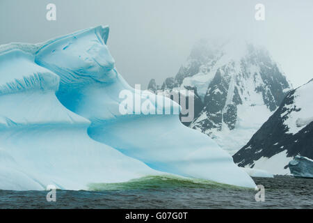 Iceberg and Mountains, Petermann island, Antarctic Peninsula, Antarctica