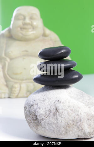 Three black stones stacked on top of each other Stock Photo