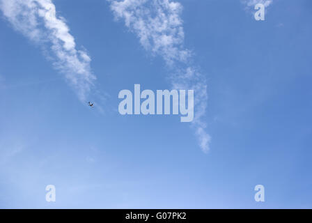 airliner airplane flying above the clouds Stock Photo