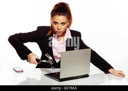 Businesswoman fixing her laptop with a hammer Stock Photo - Alamy