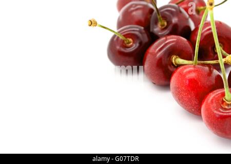 Black cherries on white background. Stock Photo