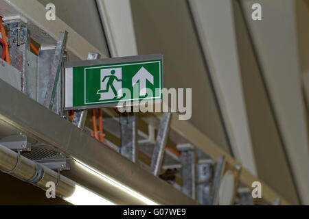 Emergency exit sign in construction site an industrial plant Stock Photo