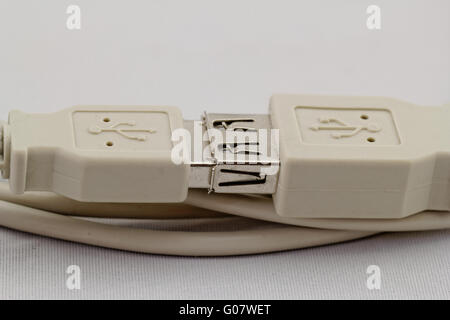 connected white usb extension cable on white background Stock Photo