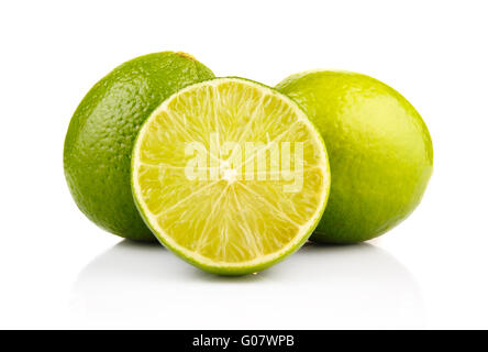 Ripe lime fruits with slices isolated on white Stock Photo