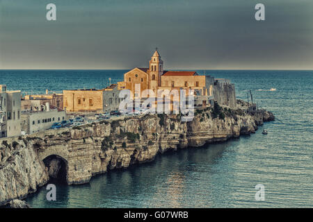 Vieste in Italy, an old Town on sea cliff and beaches: ancient houses and church Stock Photo