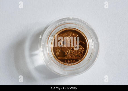 A proof half Sovereign in its container with a paper background Stock Photo