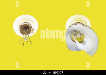 Old,damaged,exploded lamps on a yellow background Stock Photo