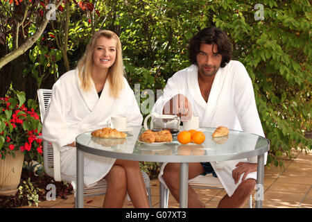 Couple eating breakfast on the terrace Stock Photo