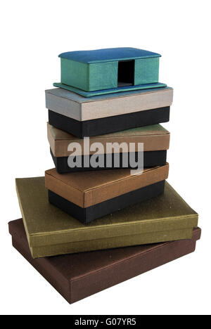 Stacked silk gift boxes isolated on white backgrou Stock Photo