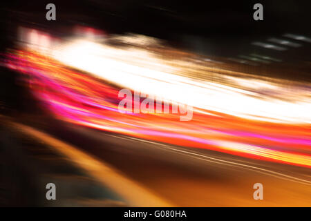 Abstract image of the light trails in night traffic in the city. Speeding concept Stock Photo