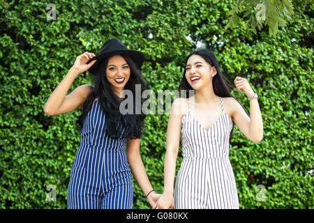 Two happy and lively female best friends having a good time together - friendship and fun time concept Stock Photo