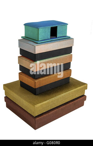 Stacked colored silk gift boxes isolated on white Stock Photo