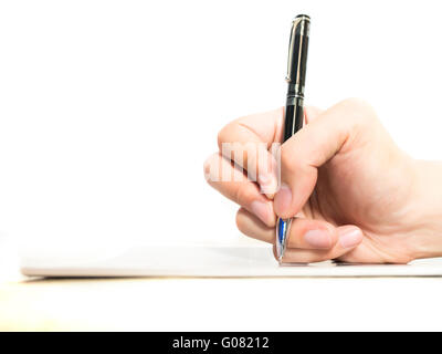 Hands with pen on notebook isolated on white background Stock Photo