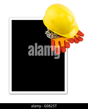 Yellow hard hat and protective gloves isolated with empty frame Stock Photo