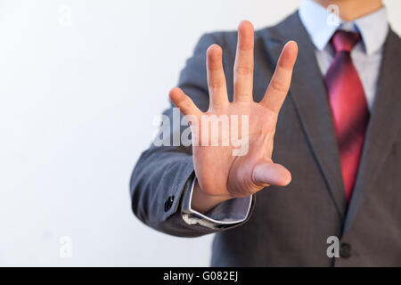 Businessman pinching in the air with five fingers - Digital and imagination concept Stock Photo