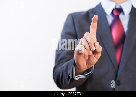 Businessman pressing in the air with one finger - Digital and imagination concept Stock Photo