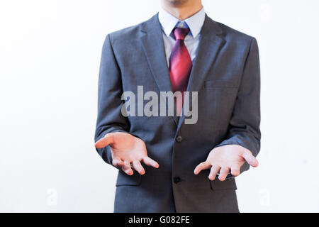 Business man in suit showing confused sign on isolated white background Stock Photo