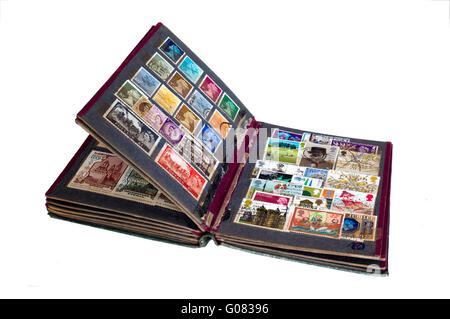 Vintage stamp album with postage stamps isolated o Stock Photo