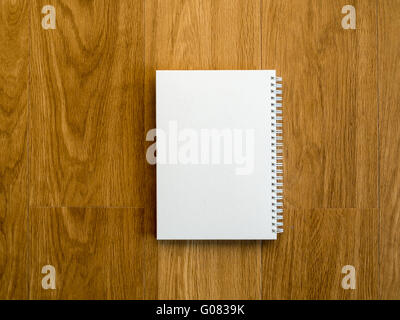 Empty notebook cover on wooden vintage table with copy space Stock Photo