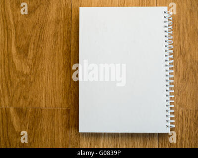 Empty notebook cover on wooden vintage table with copy space Stock Photo